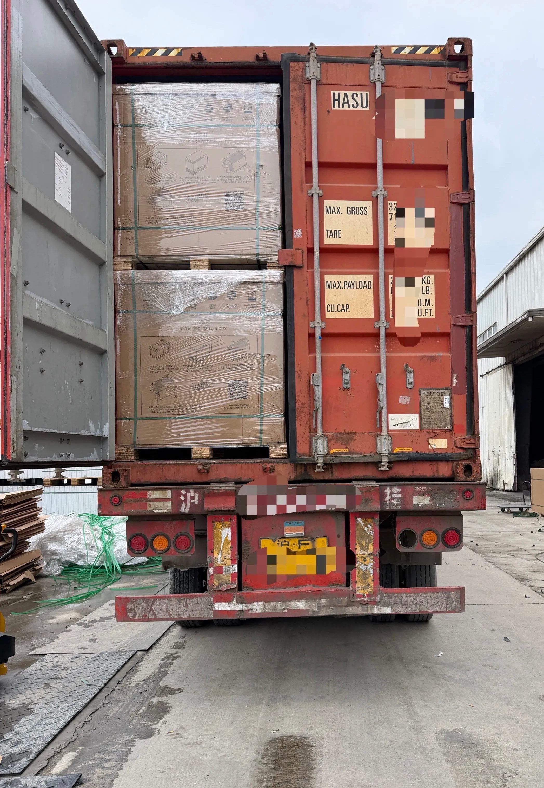 Solar BOS pallets loaded into an export container for shipment